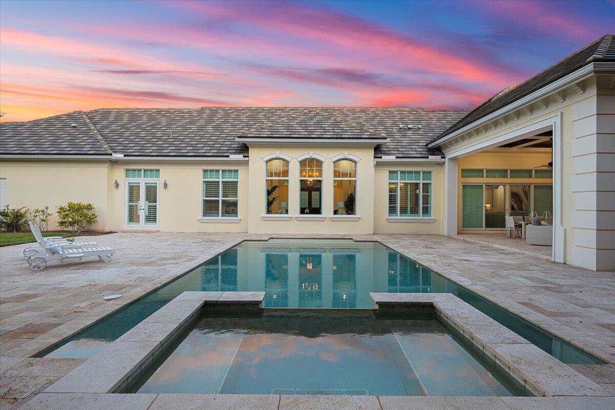 5775 Lady Luck Road Palm Beach Gardens, FL 33418 - Photo 36 of 45 a front view of a house with a yard