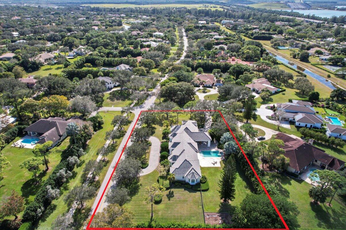 5775 Lady Luck Road Palm Beach Gardens, FL 33418 - Photo 40 of 45 an aerial view of residential houses with outdoor space and street view