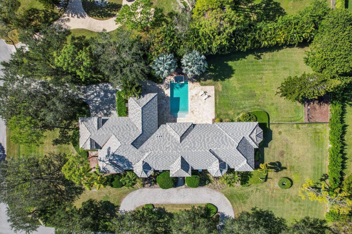 5775 Lady Luck Road Palm Beach Gardens, FL 33418 - Photo 42 of 45 an aerial view of a house with swimming pool and garden
