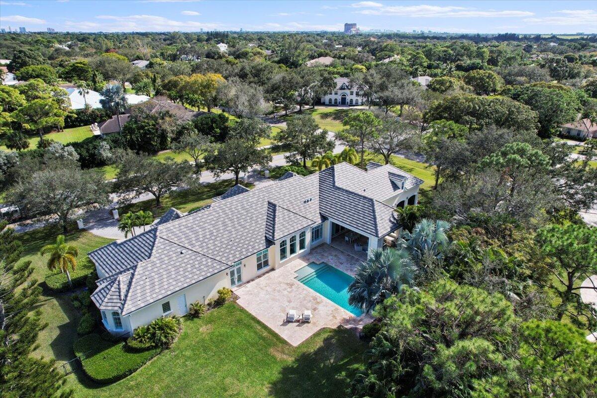 5775 Lady Luck Road Palm Beach Gardens, FL 33418 - Photo 43 of 45 an aerial view of a house with a yard and lake view