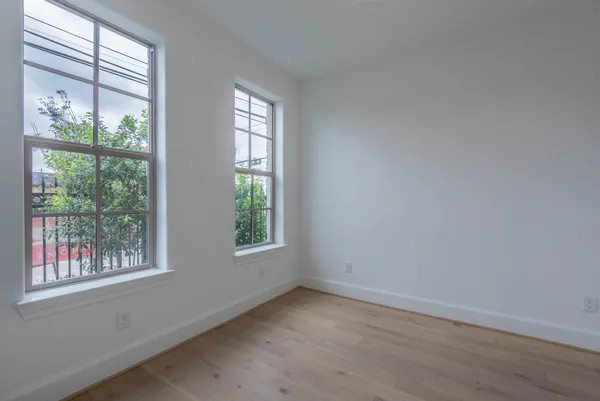 an empty room with a empty space and a ceiling fan