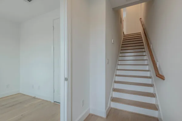 a spacious bathroom with a double vanity sink and mirror