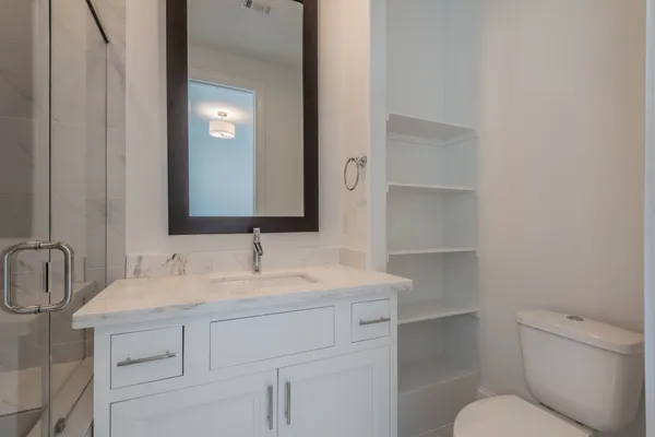 a bathroom with a double vanity sink and mirror