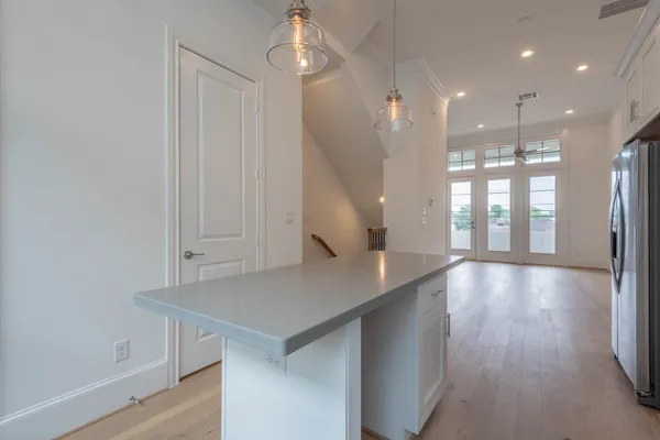 a kitchen with stainless steel appliances a refrigerator and a sink