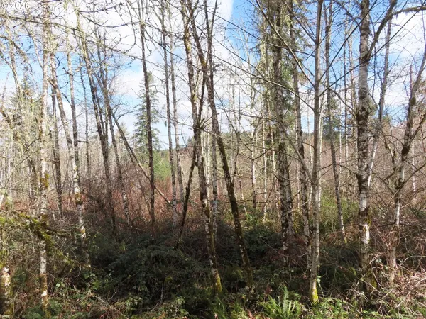 a view of residential houses with trees
