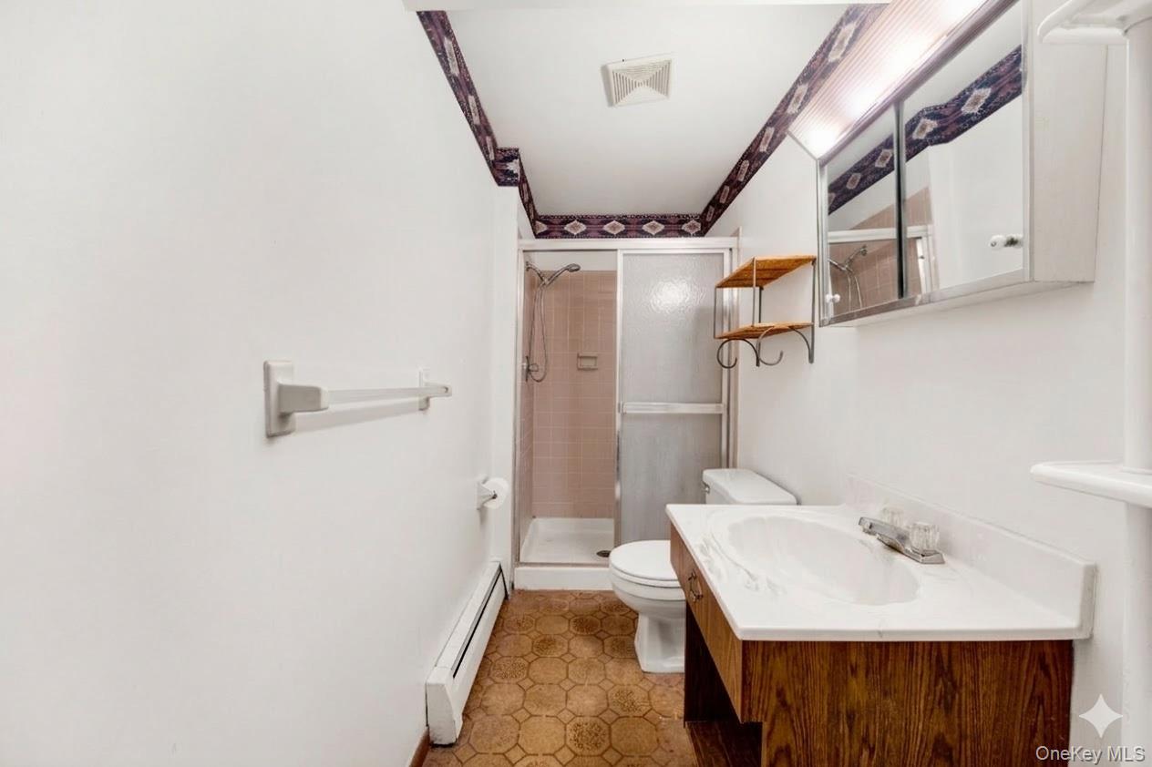 17 Last Road Middletown, NY 10941 - Photo 15 of 22 a bathroom with a sink a toilet and shower