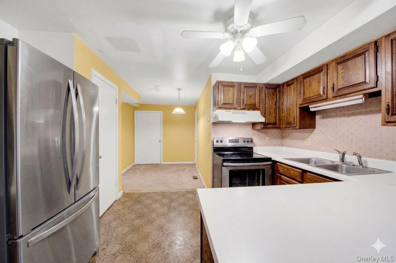17 Last Road Middletown, NY 10941 - Photo 18 of 22 a kitchen with kitchen island a counter top space a sink stainless steel appliances and cabinets