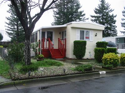 Front yard with street access and a redwood porch.  Roof only 5 yrs old. Dual pane windows.
