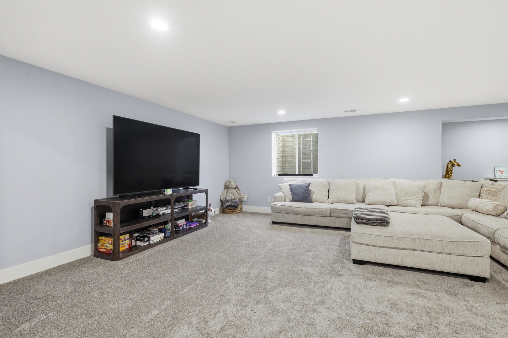 6779 Genesis Way Bettendorf, IA 52722 - Photo 26 of 36 a living room with furniture and a flat screen tv