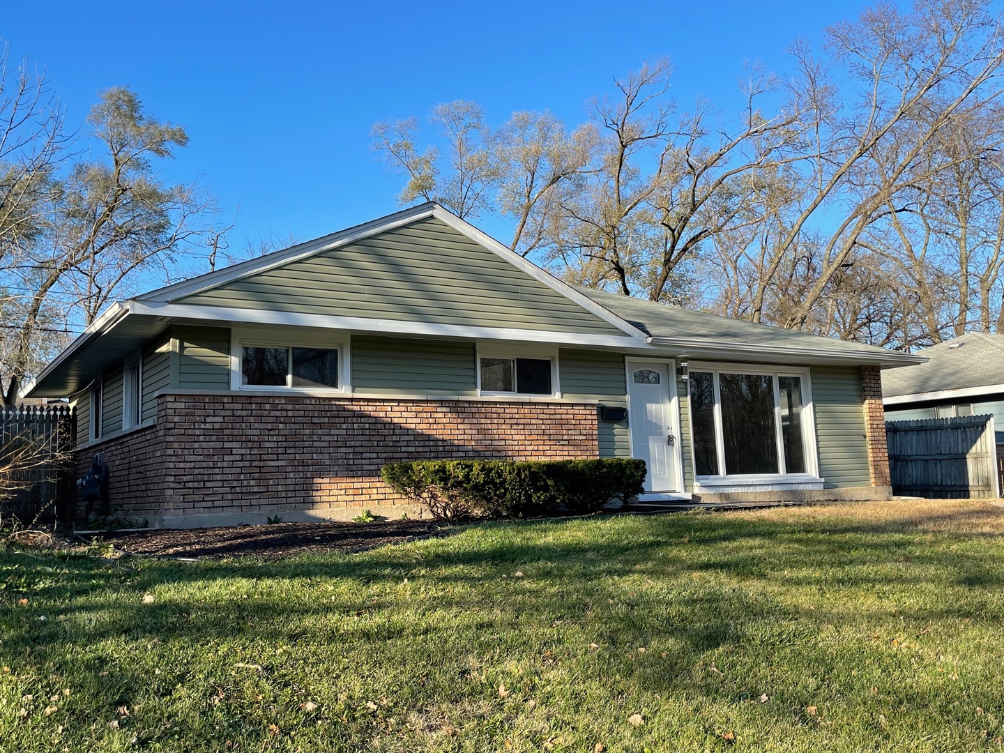 186 Monee Road Park Forest, IL 60466 - Photo 3 of 13 a front view of a house with a garden