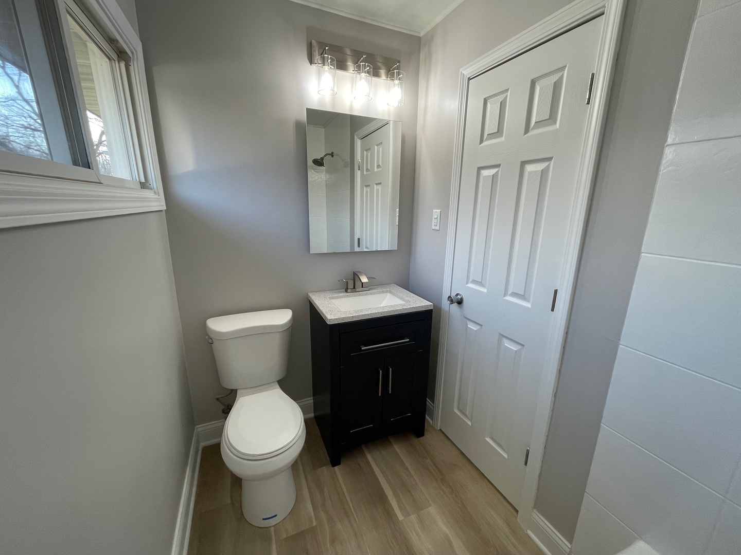 186 Monee Road Park Forest, IL 60466 - Photo 9 of 13 a bathroom with a toilet a sink and mirror