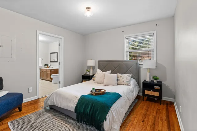 a bedroom with a bed and a couch