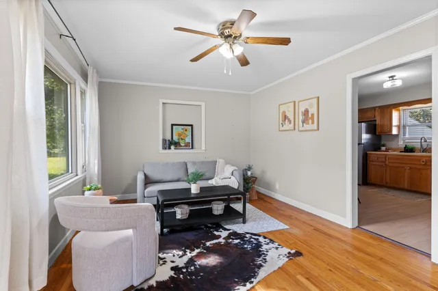 a living room with furniture and a window