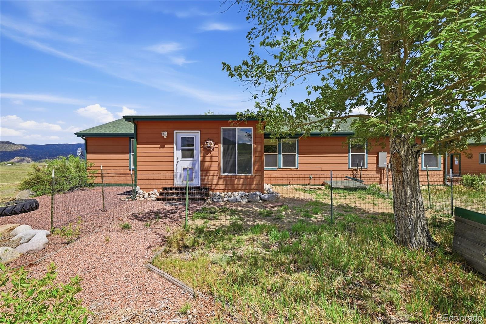 20300 Old Ranch Loop Nathrop, CO 81236 - Photo 23 of 35 a backyard of a house with seating space