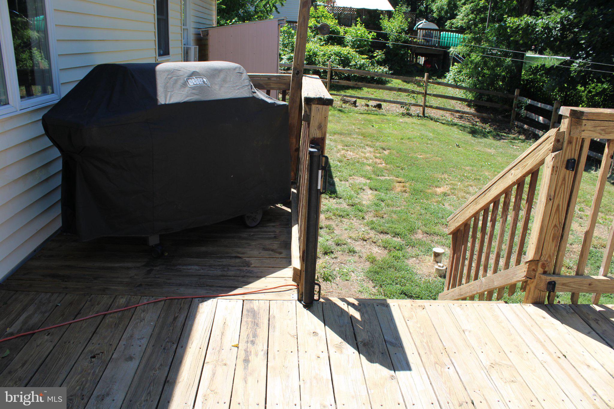 182 Rose Valley Road Pottstown, PA 19464 - Photo 9 of 52 Sunny deck with a grill and greenery.