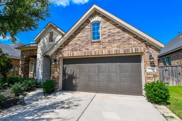 a front view of a house with garage