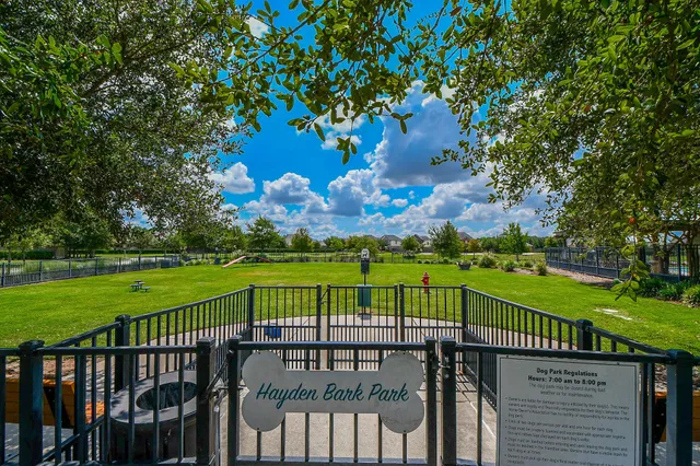 a view of a wooden deck with a garden