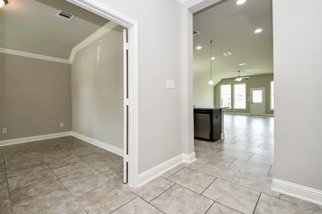 en view of a hallway with wooden floor