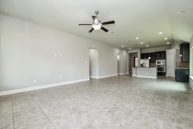 a view of a kitchen with a sink and a stove top oven