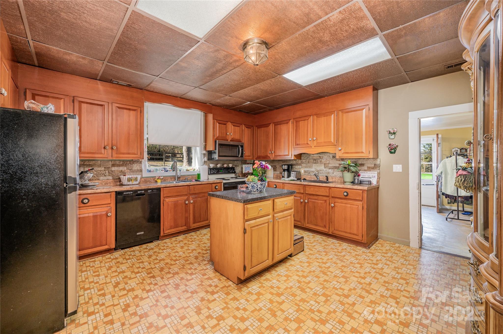4833 Casar Road Lawndale, NC 28090 - Photo 12 of 48 a kitchen with stainless steel appliances granite countertop a stove refrigerator sink and cabinets