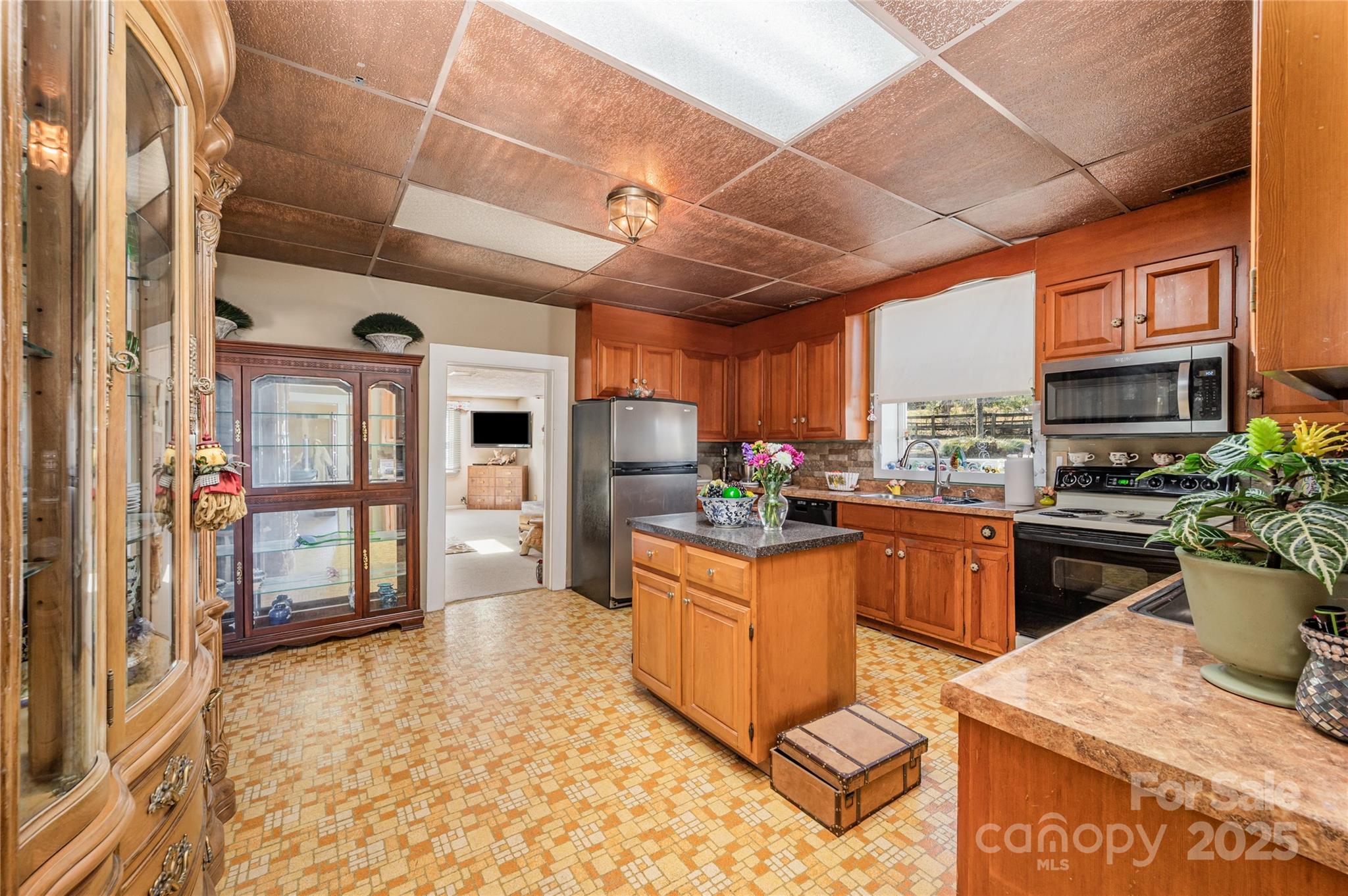 4833 Casar Road Lawndale, NC 28090 - Photo 14 of 48 a kitchen with stainless steel appliances granite countertop a stove a sink dishwasher and cabinets with wooden floor