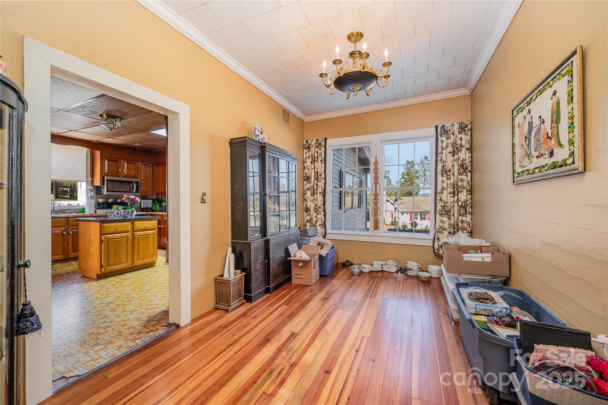 4833 Casar Road Lawndale, NC 28090 - Photo 16 of 48 a view of a livingroom with furniture wooden floor a chandelier and windows