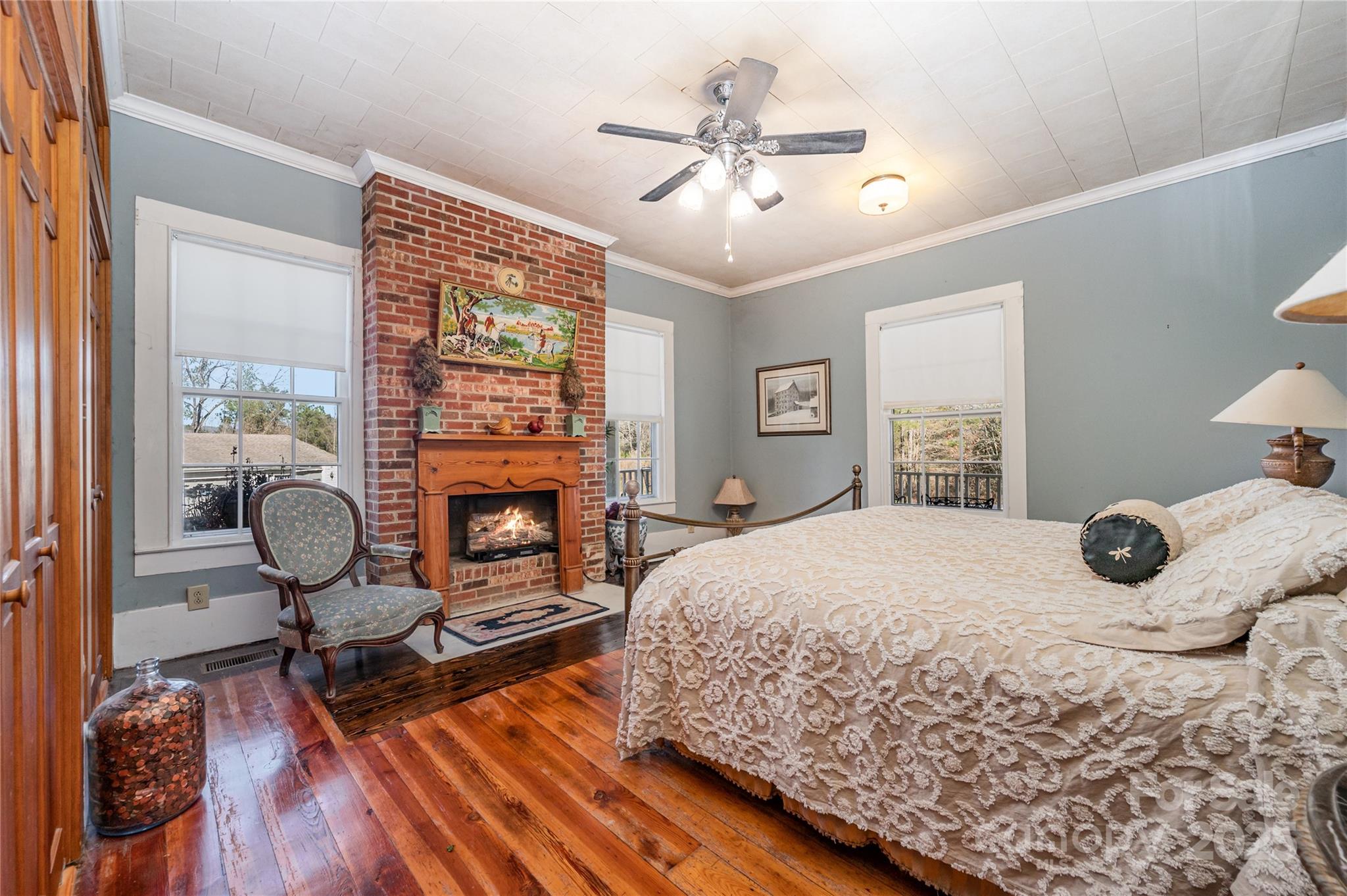 4833 Casar Road Lawndale, NC 28090 - Photo 17 of 48 a bedroom with a bed and a chandelier