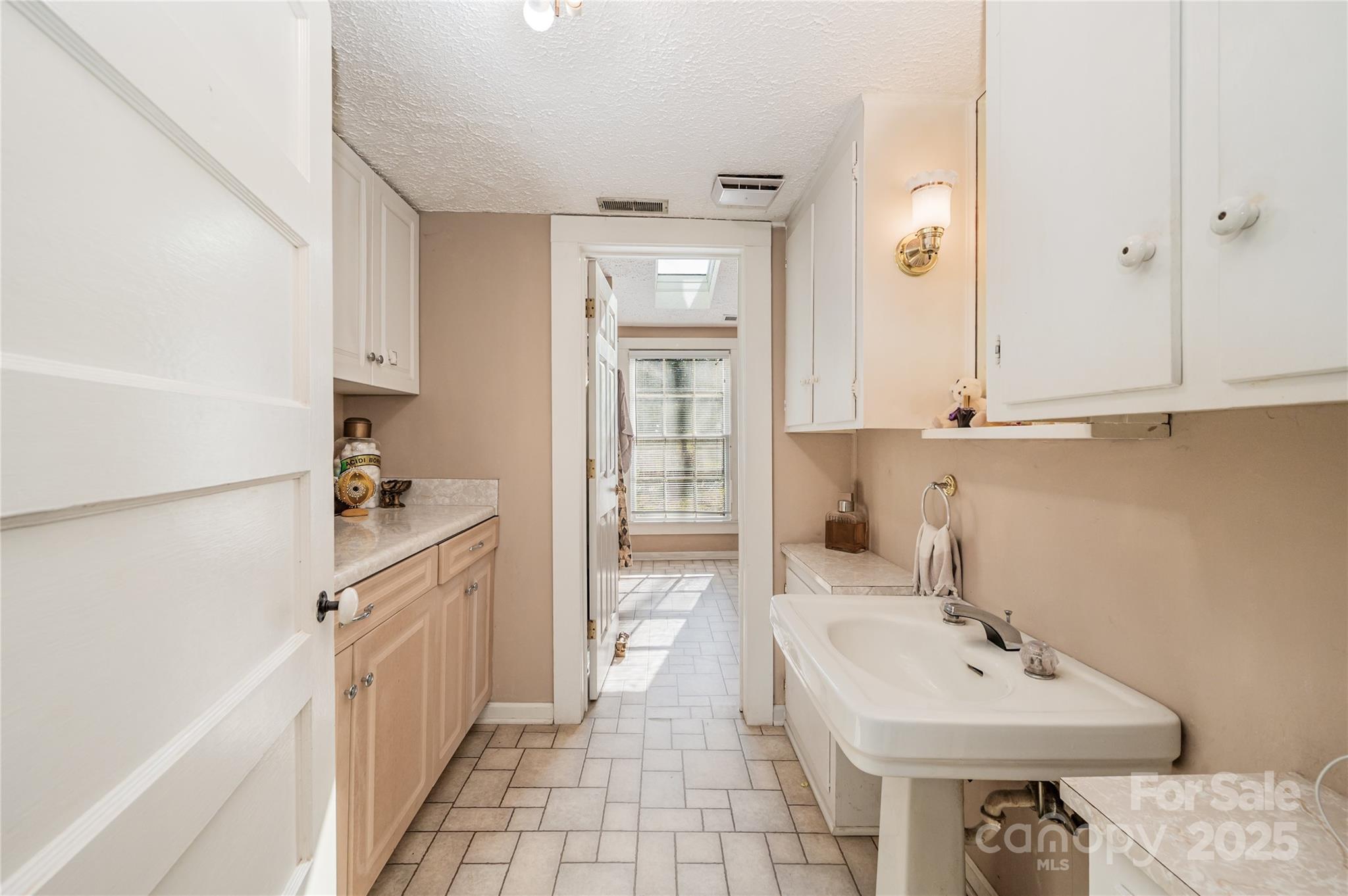 4833 Casar Road Lawndale, NC 28090 - Photo 19 of 48 a bathroom with a sink and a mirror
