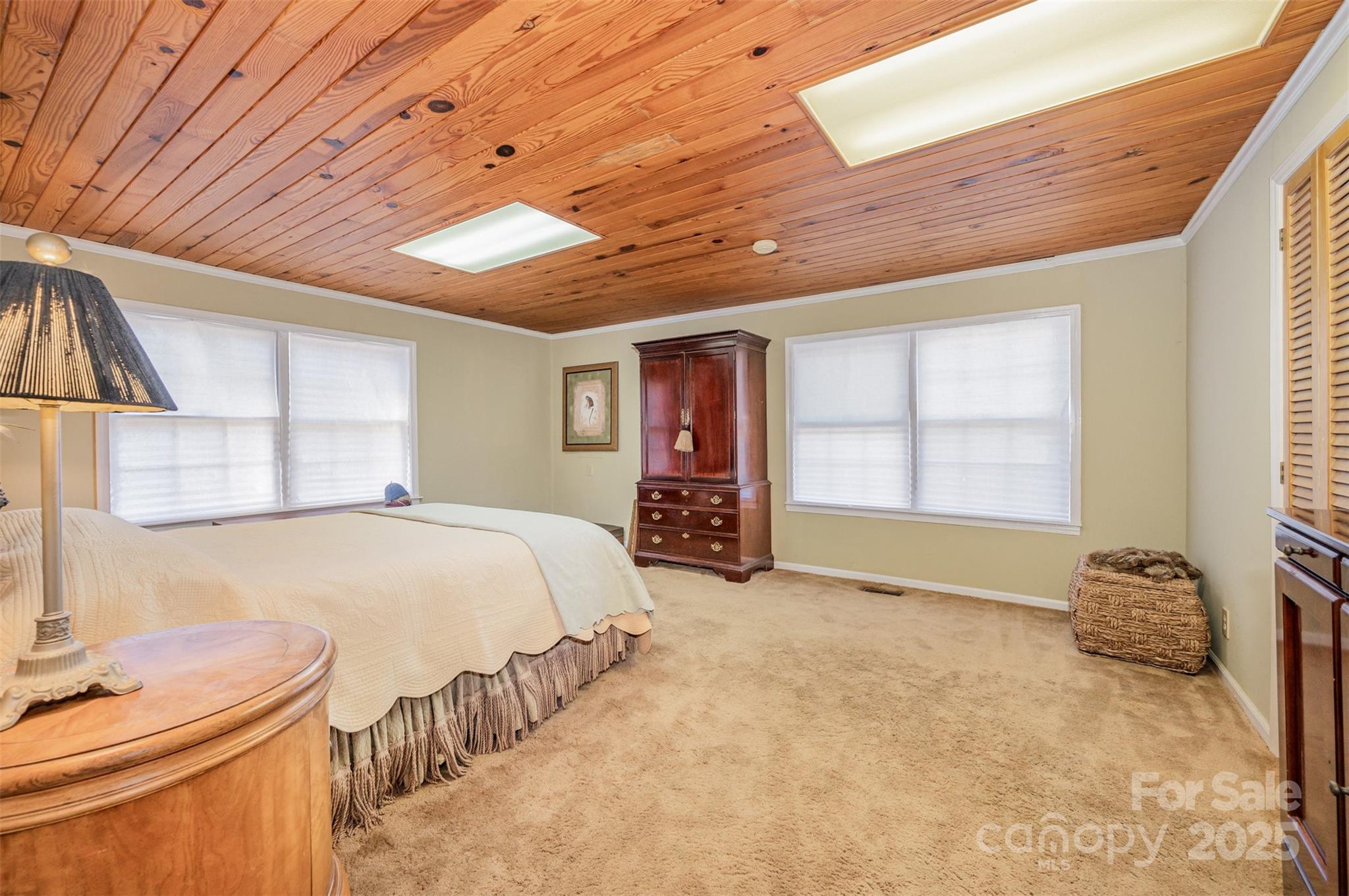 4833 Casar Road Lawndale, NC 28090 - Photo 27 of 48 a spacious bedroom with a bed and a large window