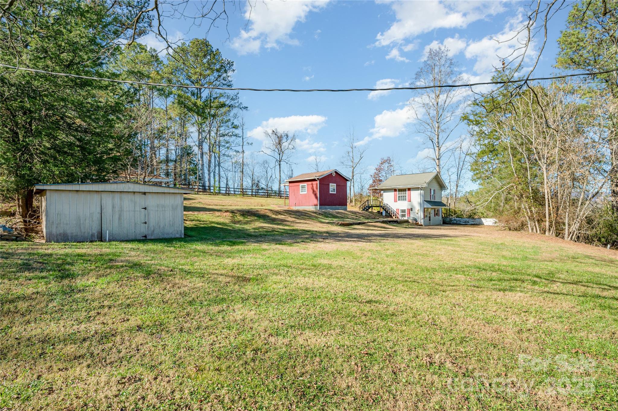 4833 Casar Road Lawndale, NC 28090 - Photo 31 of 48 a view of a house with a yard and a tree