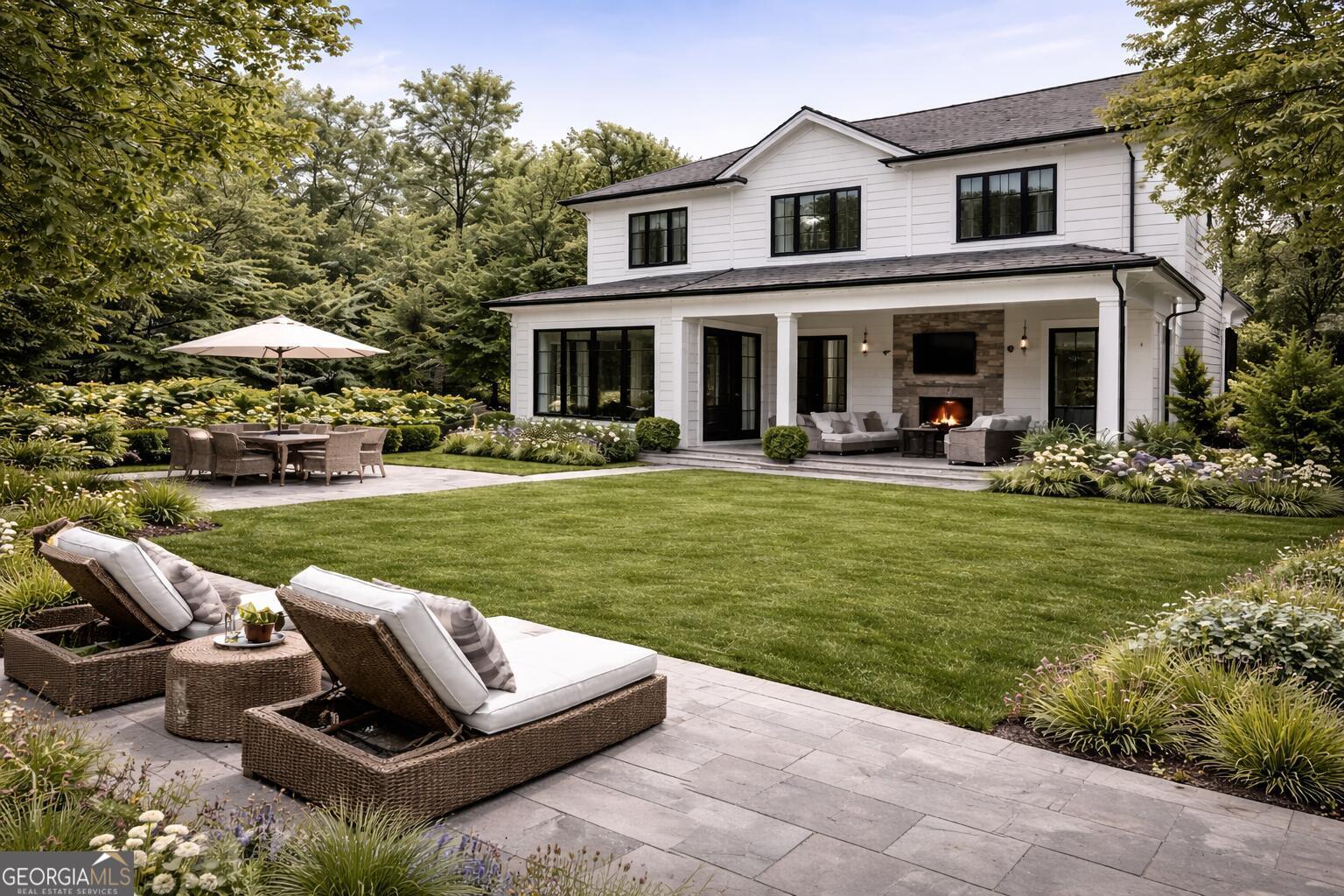 6390 Ivey Road Southeast Mableton, GA 30126 - Photo 14 of 14 a view of a house with backyard sitting area and garden