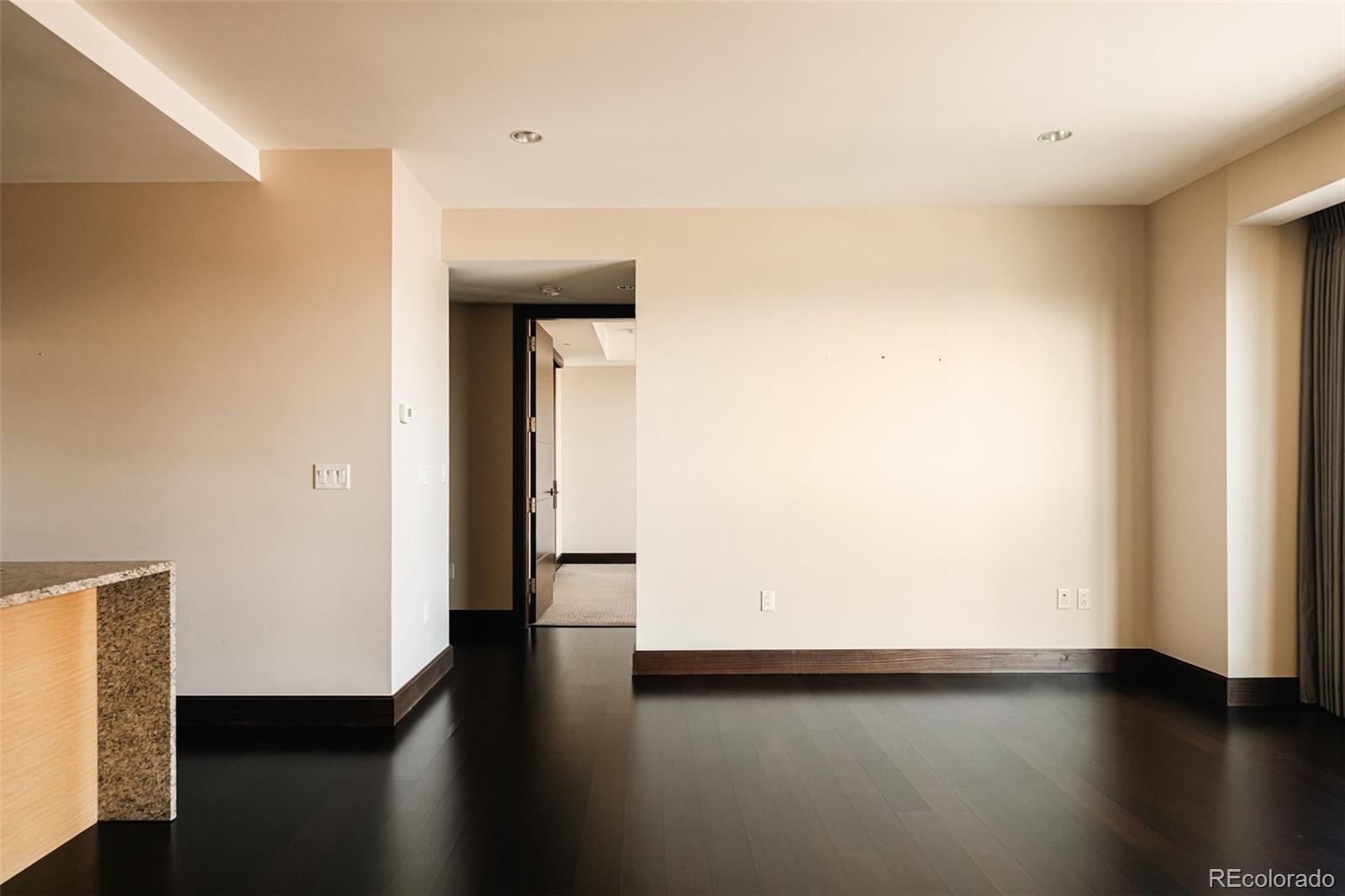 1133 14th Street, Unit 1940 Denver, CO 80202 - Photo 7 of 23 a view of a hallway with wooden floor