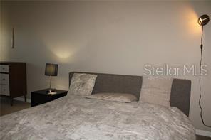 5681 Bidwell Parkway, Unit 204 Sarasota, FL 34233 - Photo 22 of 41 a bed room with a bed
