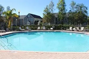 a view of living room with furniture wooden floor and a fireplace