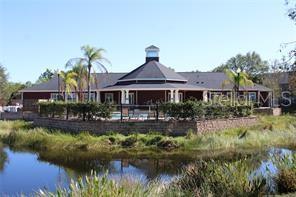 5681 Bidwell Parkway, Unit 204 Sarasota, FL 34233 - Photo 41 of 41 a front view of a house with swimming pool