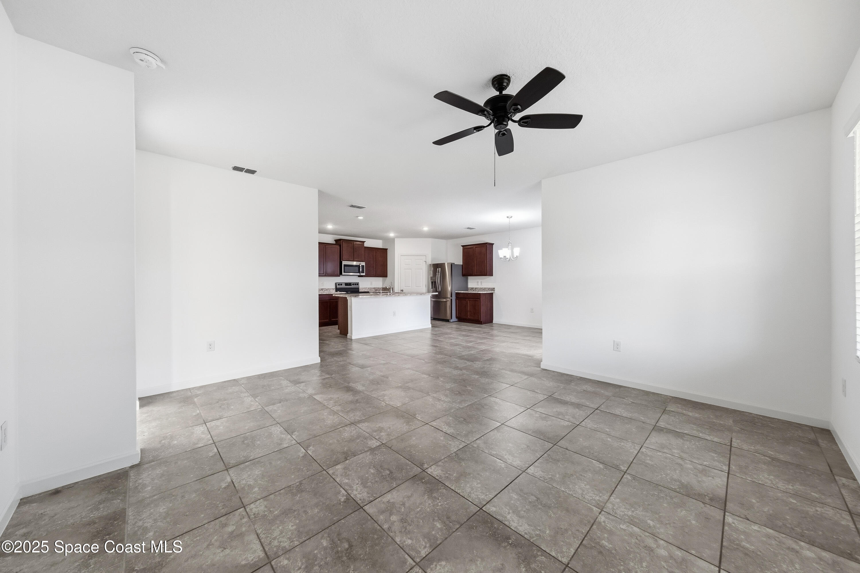 377 Snook Place Cocoa, FL 32927 - Photo 11 of 32 a view of a kitchen with a sink and a window