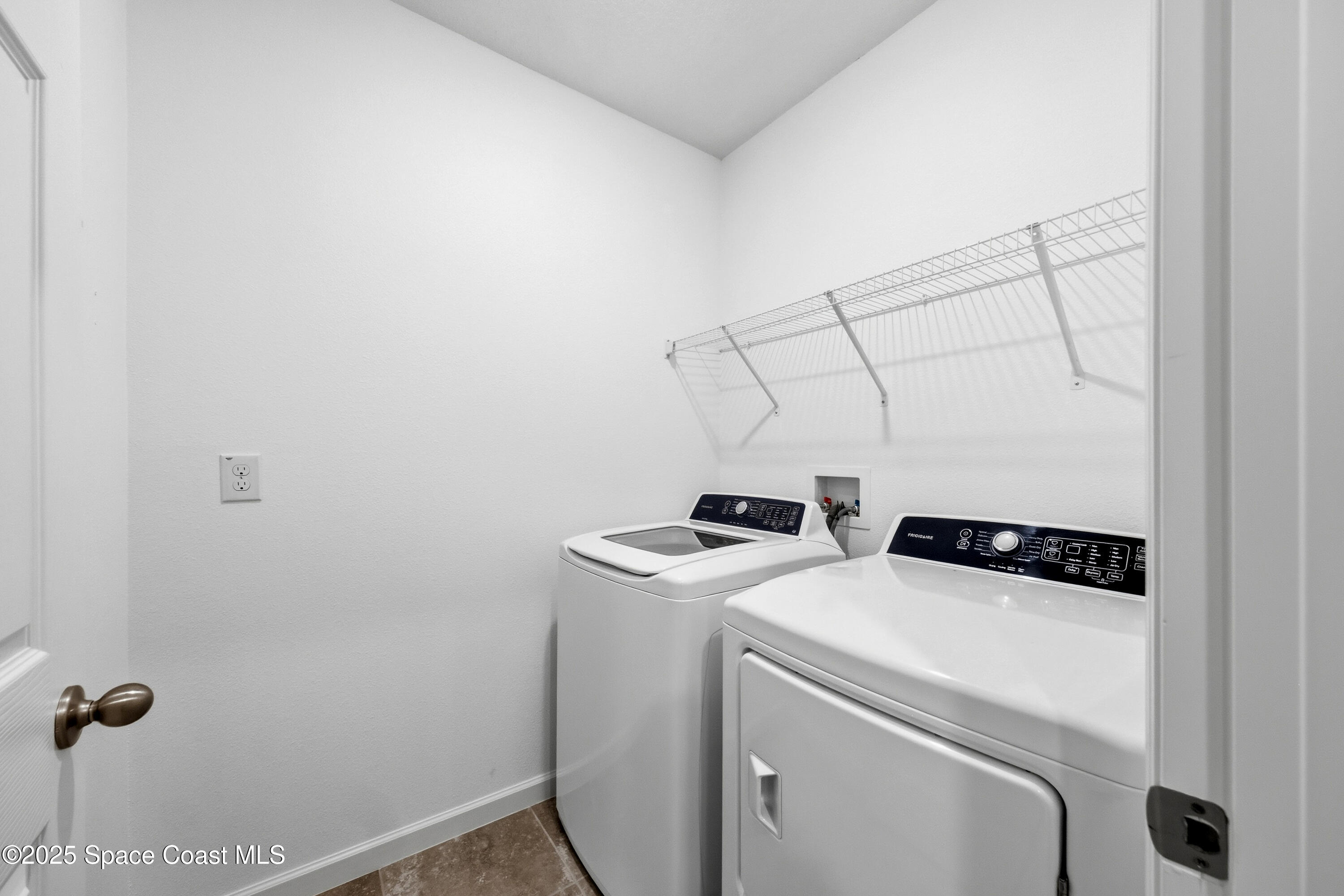 377 Snook Place Cocoa, FL 32927 - Photo 26 of 32 a utility room with dryer and washer