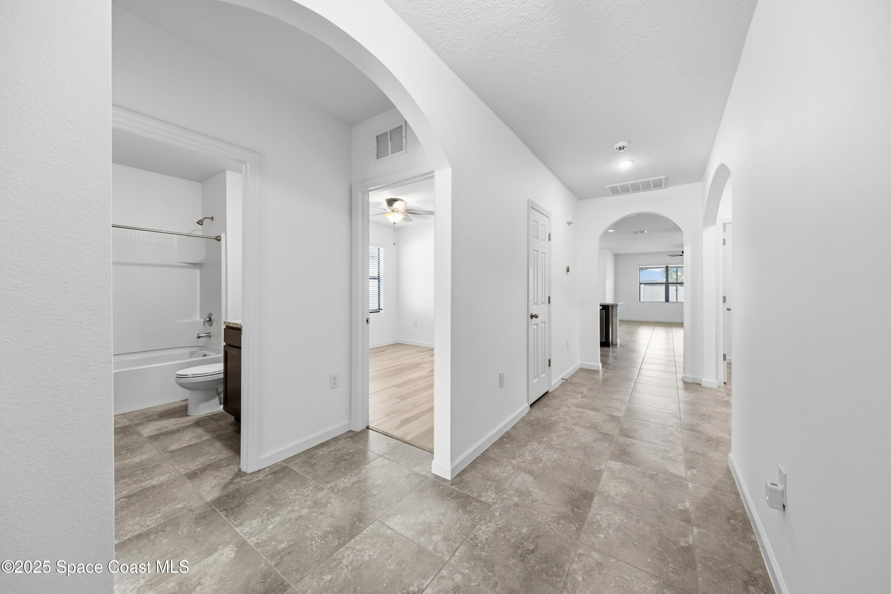377 Snook Place Cocoa, FL 32927 - Photo 4 of 32 wooden floor with a bathroom