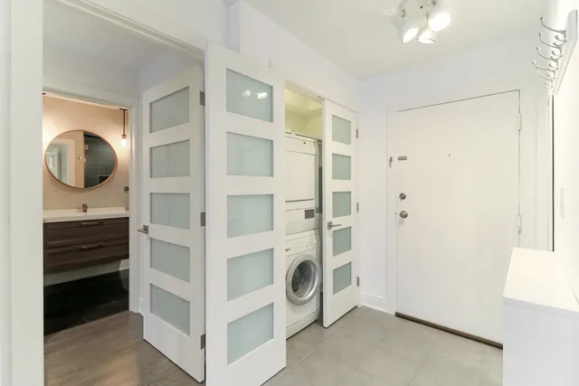 a bathroom with a sink mirror and toilet