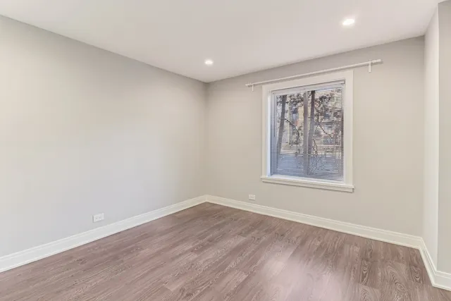 a bedroom with bed and a window