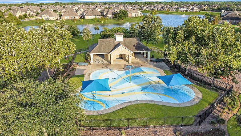 13415 Star Creek Lane Rosharon, TX 77583 - Photo 44 of 46 an aerial view of residential houses with outdoor space and trees