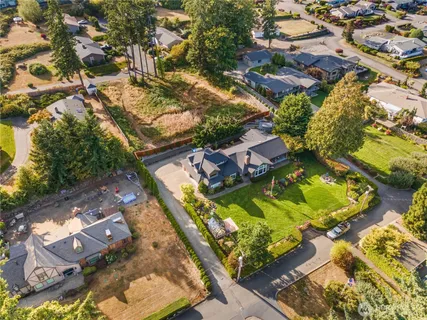 an aerial view of residential houses with outdoor space