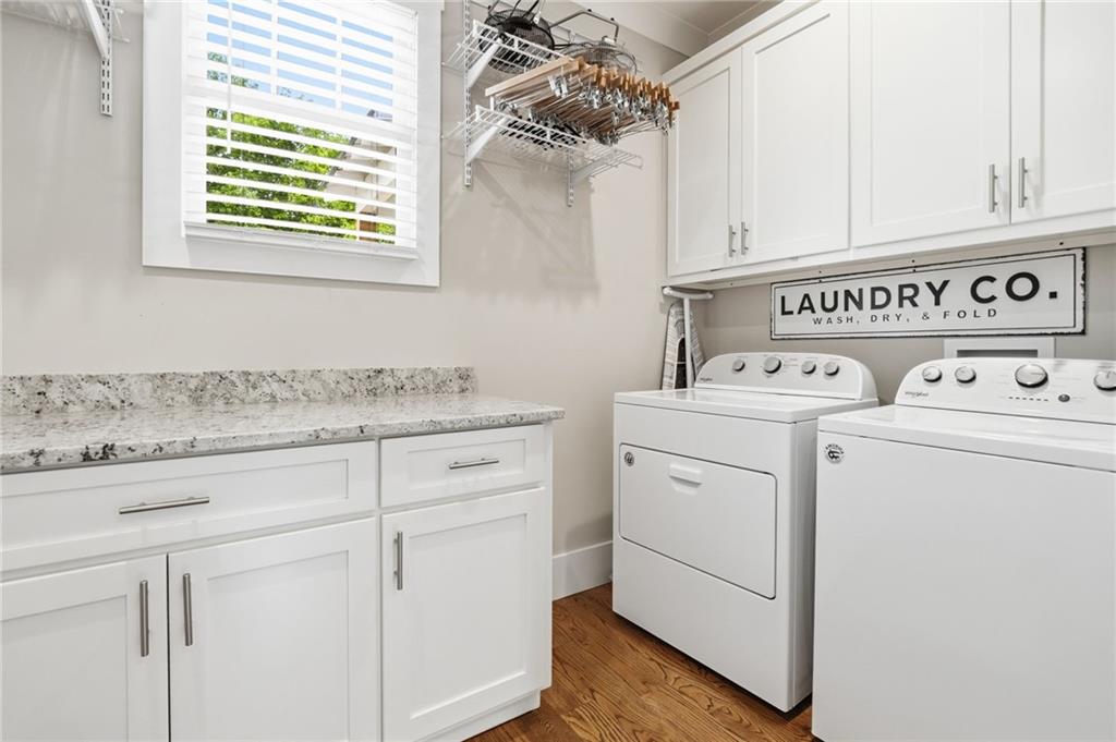 180 Laurel Ridge Lane Ball Ground, GA 30107 - Photo 22 of 71 a utility room with dryer and washer