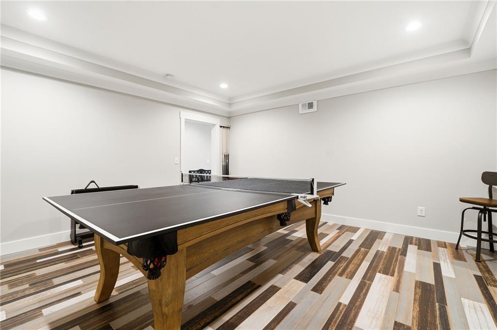 180 Laurel Ridge Lane Ball Ground, GA 30107 - Photo 45 of 71 a room with wooden floor and pool table