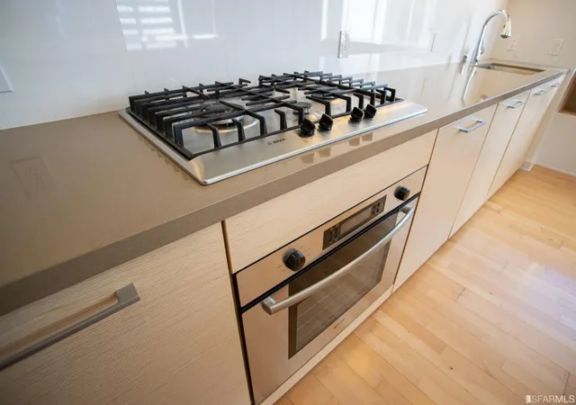 a black and white photo of a stove top oven