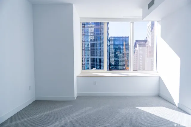 a view of an empty room with a window