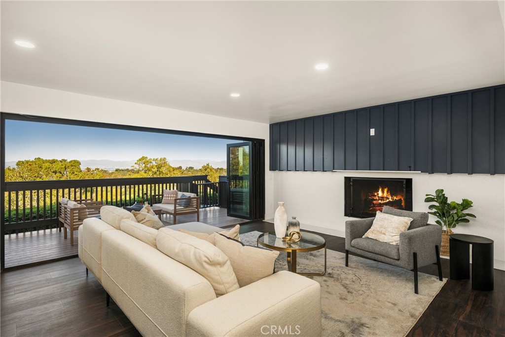 5 Yellow Brick Road Rancho Palos Verdes, CA 90275 - Photo 48 of 75 a living room with furniture a fireplace and a potted plant