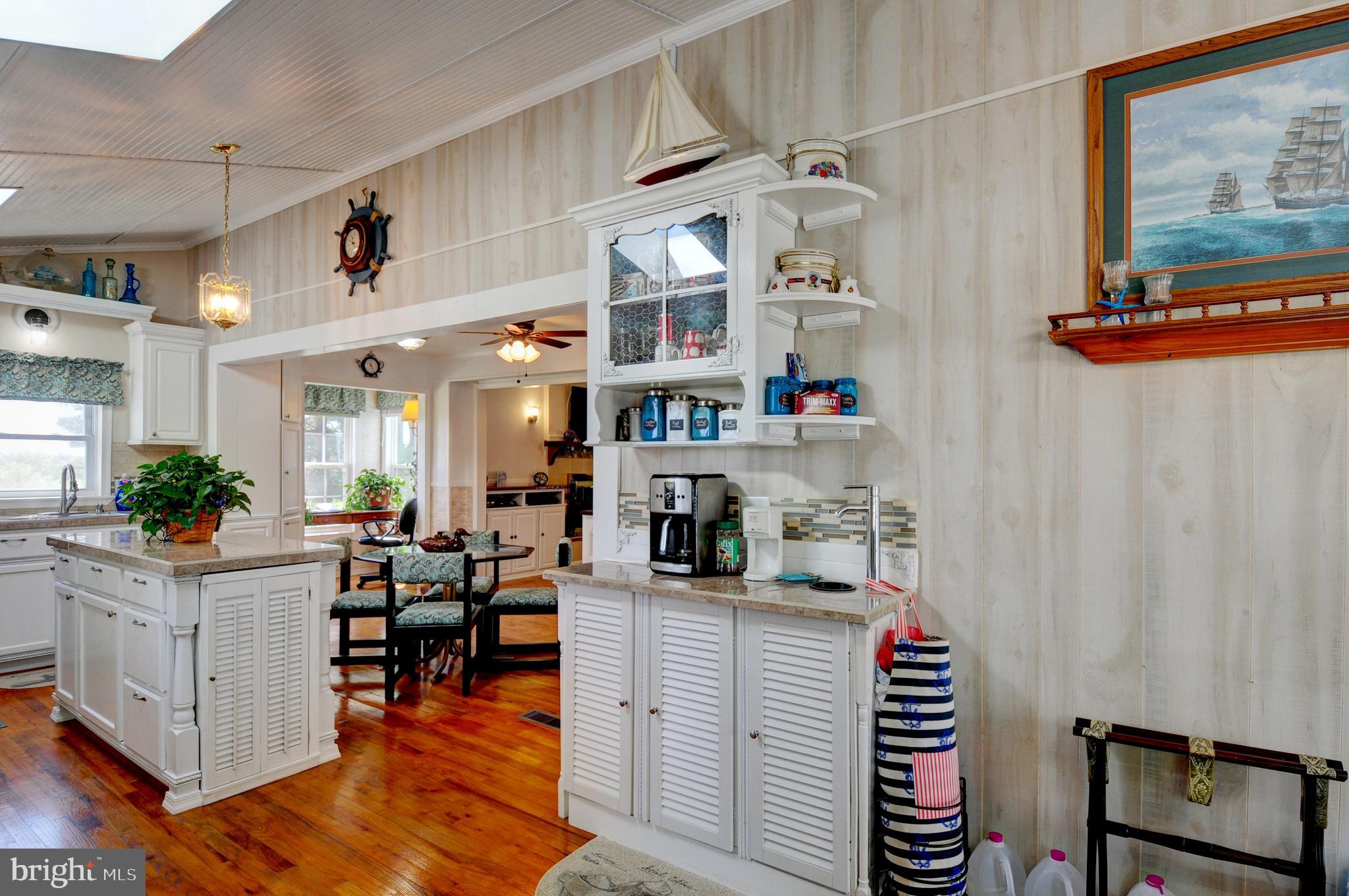384 Perry Road Winchester, VA 22602 - Photo 14 of 61 a kitchen with stainless steel appliances kitchen island granite countertop a cabinets and wooden floor
