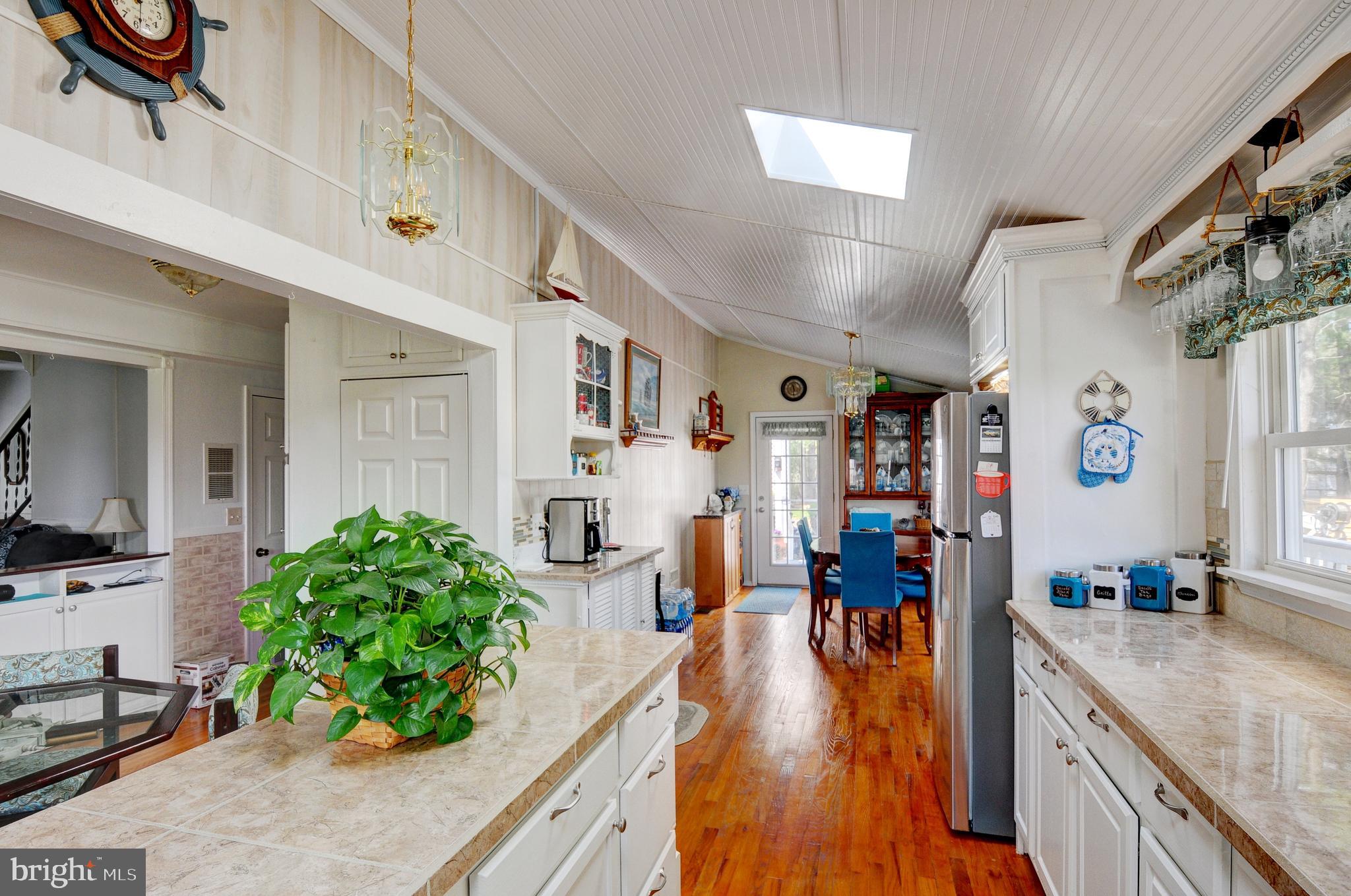 384 Perry Road Winchester, VA 22602 - Photo 16 of 61 a very nice looking living room with furniture and a kitchen