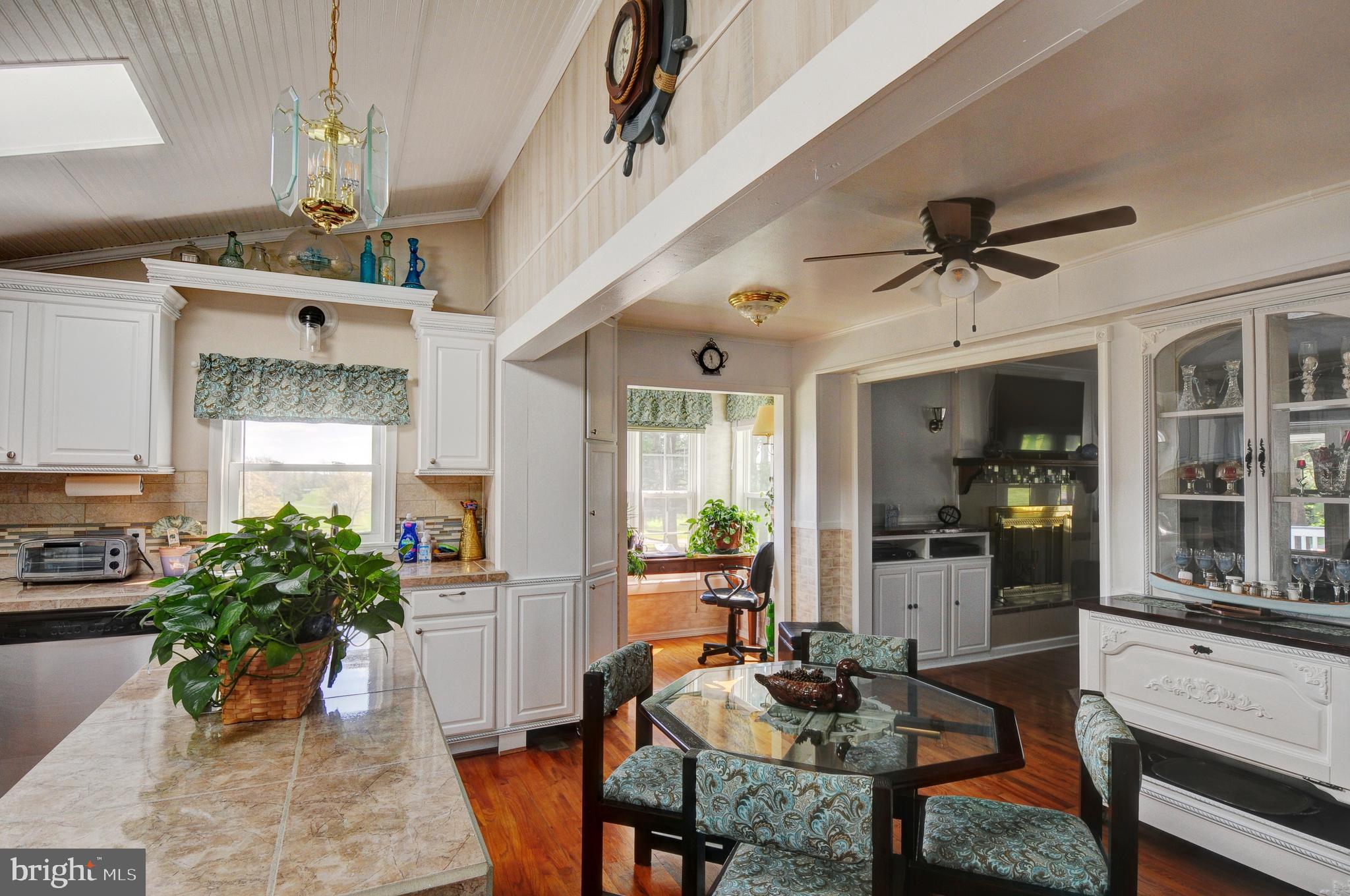 384 Perry Road Winchester, VA 22602 - Photo 18 of 61 a view of a dining room with furniture window and wooden floor